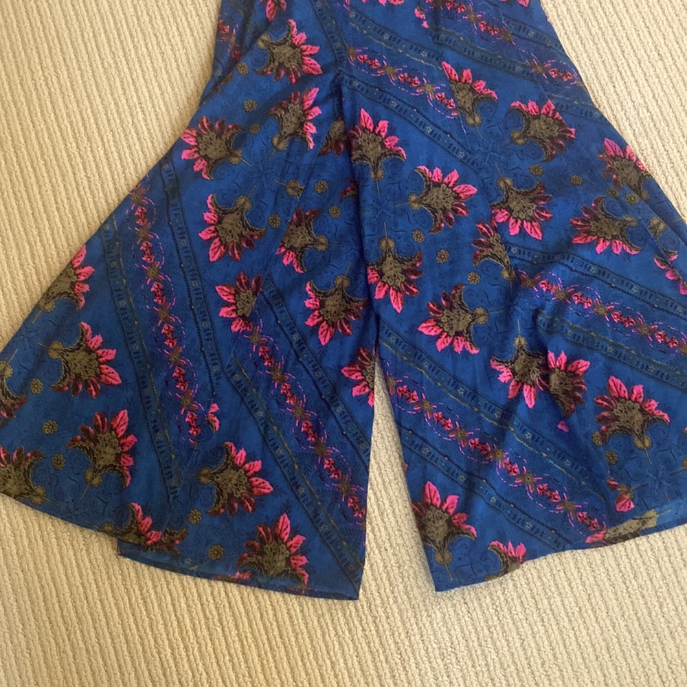 Free People colorful high waisted wide leg palazzo pants. Elastic waist in back.